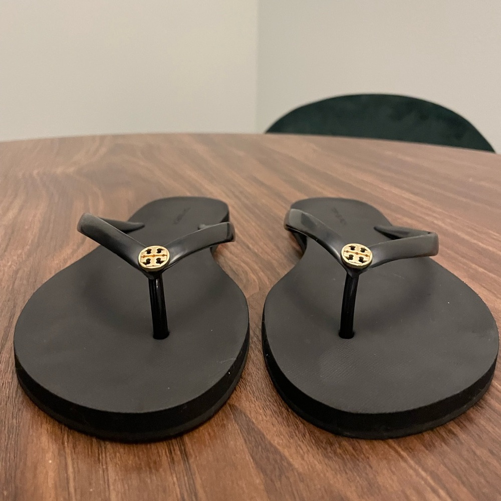 Tory Burch Black Flip Flops with Gold Emblem